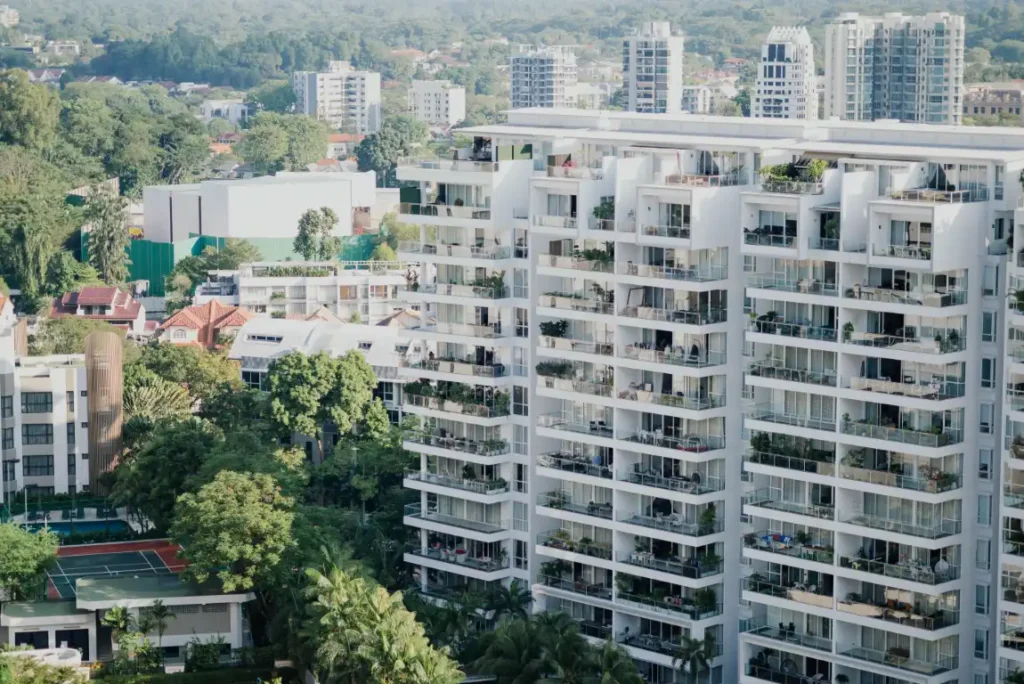 High-rise buildings with greenery in the cityscape.